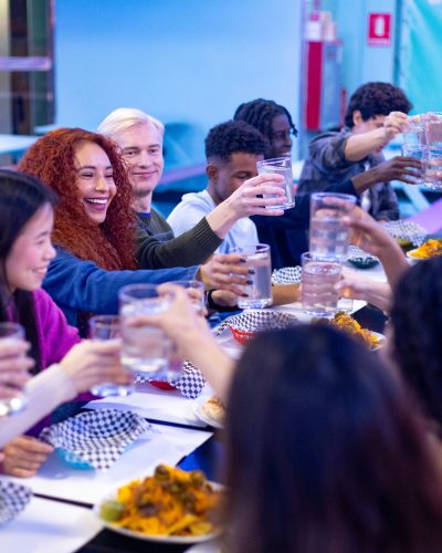 happy-multiethnic-friends-toasting-drinks-at-resta-2026-01-09-11-53-18-utc